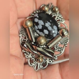 Elegant Silver and Black Brooch